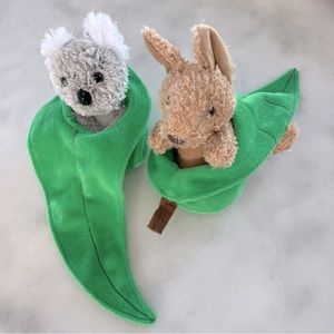 Kangaroo and Koala Snuggles soft toys in eucalyptus leaf.